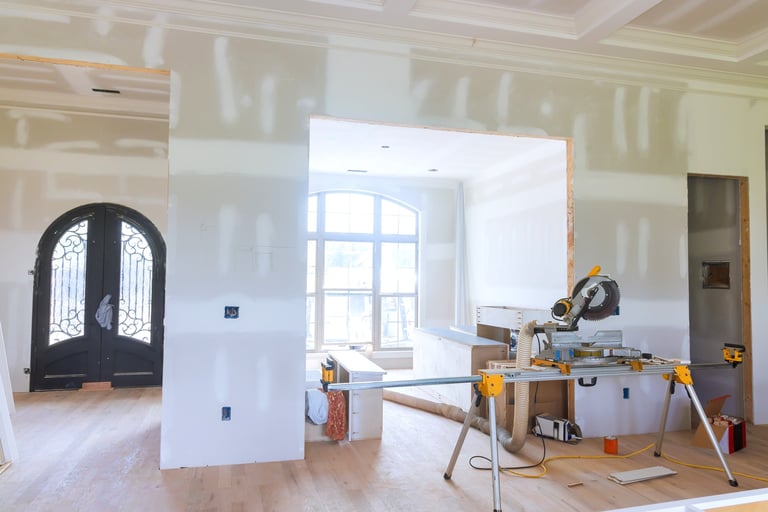 Modern living space during home renovation with tools and unfinished walls